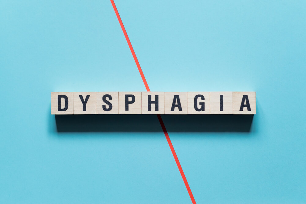 Dysphagia word concept on cubes